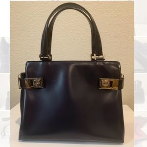 Salvatore Ferragamo navy bag with gold accessory